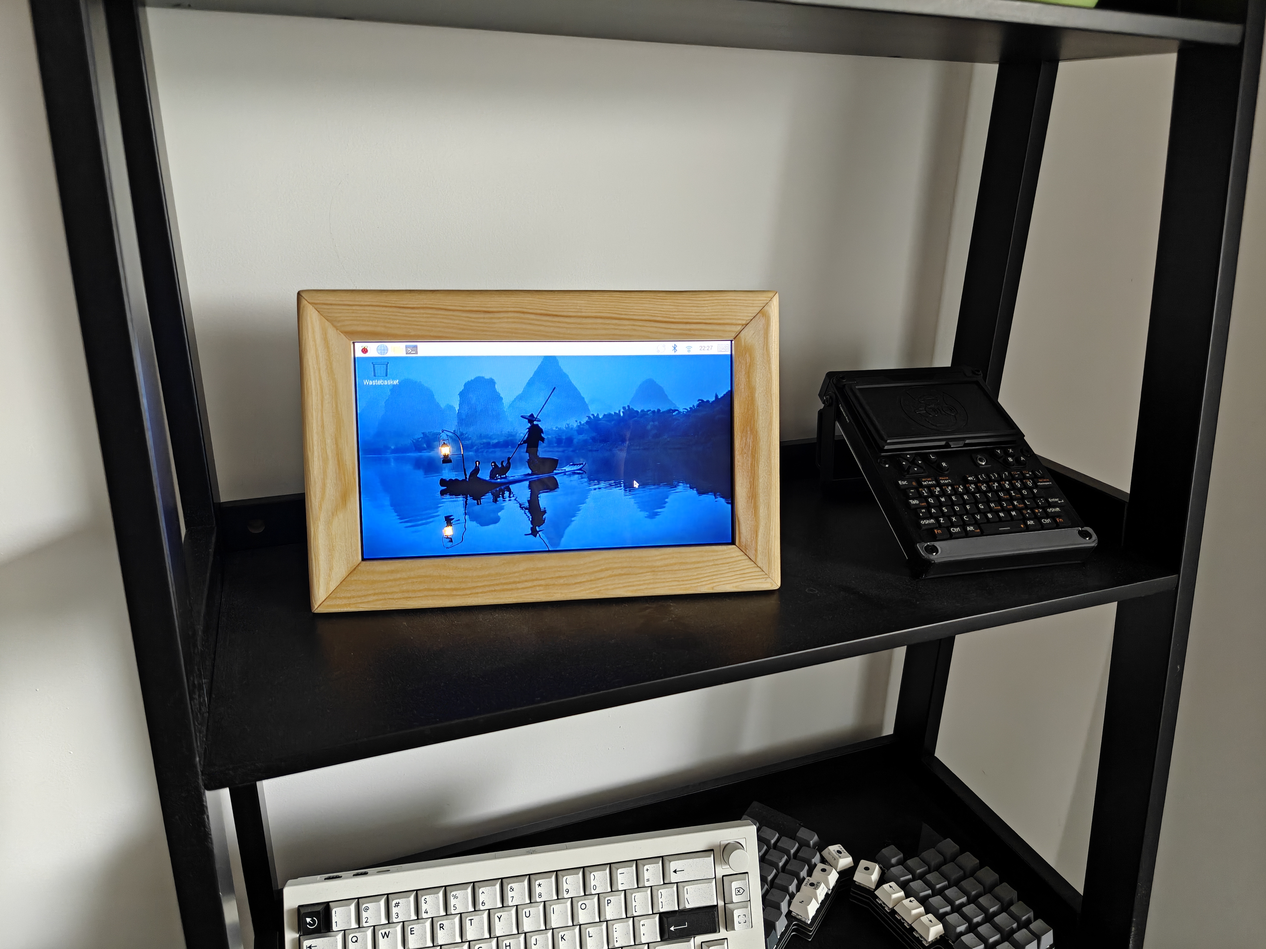 Finished Domino Frame on shelf showing Raspberry Pi OS Desktop